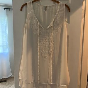 Sleeveless, white blouse